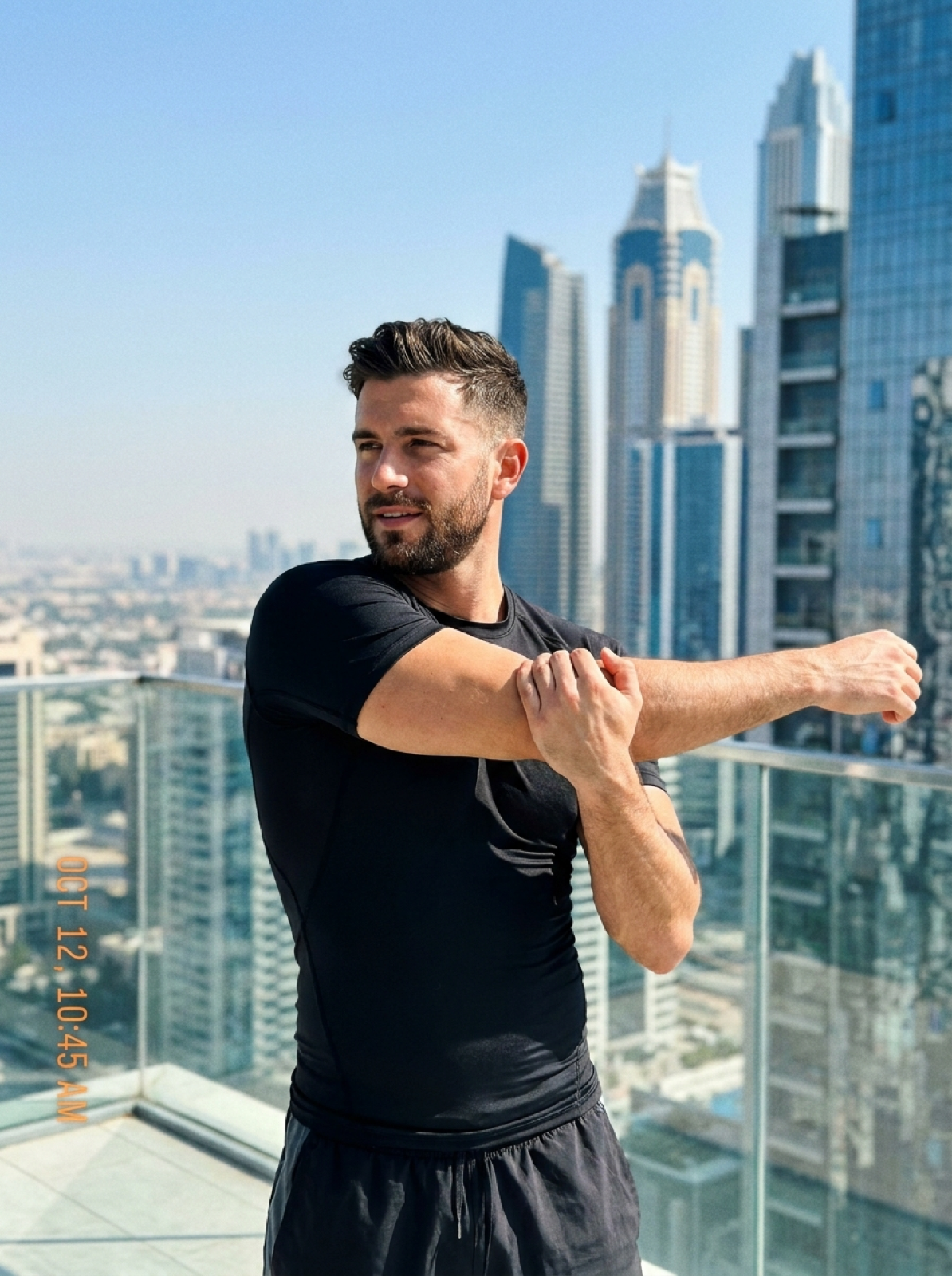 Man stretching outdoors in the city